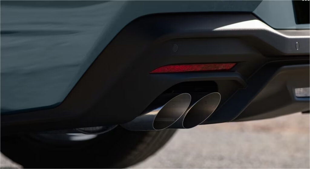 2025 Ford Mustang GT rear view with quad exhaust and 19″ Ebony Black wheels