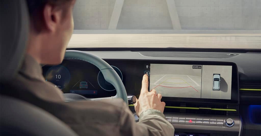 All-new 2024 Hyundai KONA interior showcasing dual screen and parking sensors.