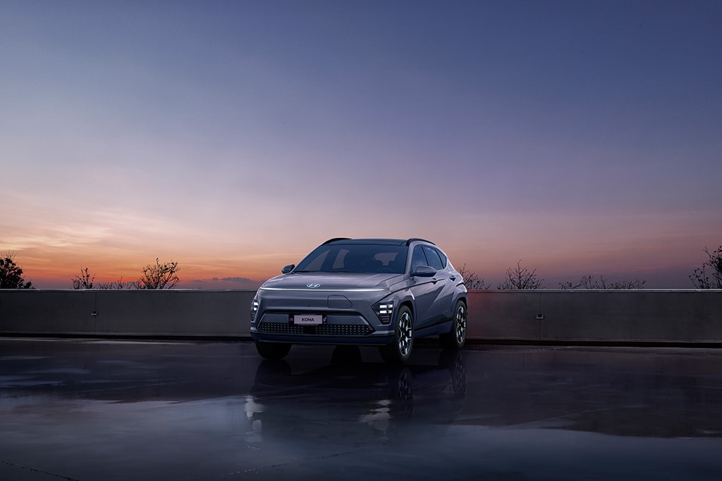 Next generation Hyundai KONA Electric parked with sunset